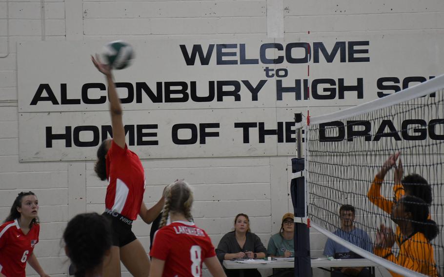Lakenheath's' A'lydia McNeal goes for a spike against the Spangdahlem Sentinels defense.  