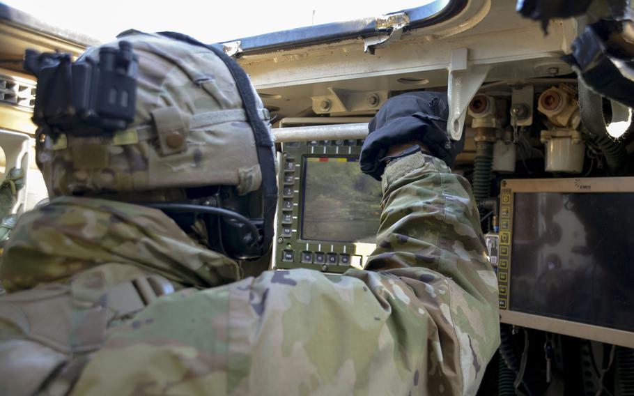 Army 1st Lt. Don Sparaco, a Stryker commander with 8th Squadron, 1st Cavalry Regiment, 2nd Stryker Brigade Combat Team, identifies targets for his gunner during an exercise at Rodriguez Live Fire Complex in Pocheon, South Korea, Tuesday, Jan. 10, 2023.