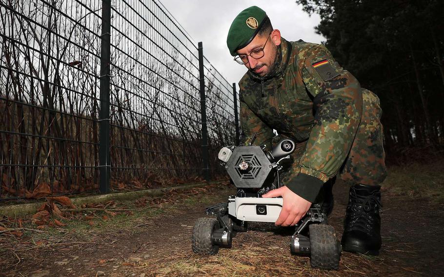 German army 1st Lt. Marc Wietfeld presents his prototype robot vehicle, Gereon, at the German army officer school in Dresden, Germany. He developed the small tactical robot as a decoy for realistic combat training.
