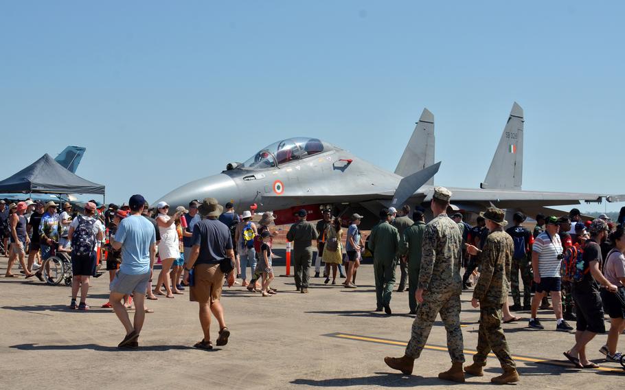 People, including U.S. Marines, walk past an Indian Sukhoi Su-30MKI fighter during an open house at Royal Australian Air Force Base Darwin, Australia, Saturday, Aug, 27, 2022. 