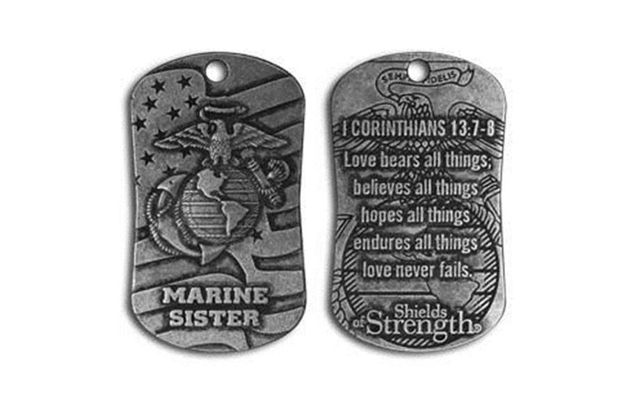 A Shields of Strength dog tag featuring the U.S. Marine Corps logo on one side and a Bible verse on the other side. A years-long dispute over the use of licensed military logos on religious-themed replica dog tags has resulted in a federal lawsuit against the Defense Department. 