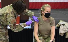 Master Sgt. Tiffany Sneeze, from the 165th Airlift Wing, administers the COVID-19 vaccination to an Airman on June 8, 2021 on Dobbins Air Force Base, GA. The Dobbins Air Force Base site administers the COVID-19 vaccine on every Tuesday for the month of June. (U.S. Army photo by CPT Amanda Russell)