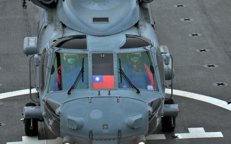 A Taiwanese military helicopter lands aboard the landing platform dock Yushan at Zuoying Naval Base, Taiwan, Jan. 12, 2023.