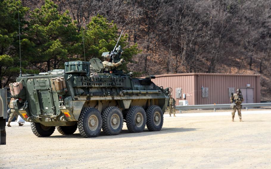 U.S. soldiers from 1st Battalion, 17th Infantry Regiment, 2nd Stryker Brigade Combat Team direct a Stryker vehicle during the Warrior Shield exercise at Rodriguez Live Fire Complex in Pocheon, South Korea, Wednesday, Mach 22, 2023.
