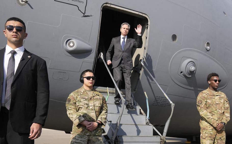 U.S. Secretary of State Antony Blinken waves as he disembarks upon arrival at Cairo East Airport in Cairo, on Feb. 6, 2024. 