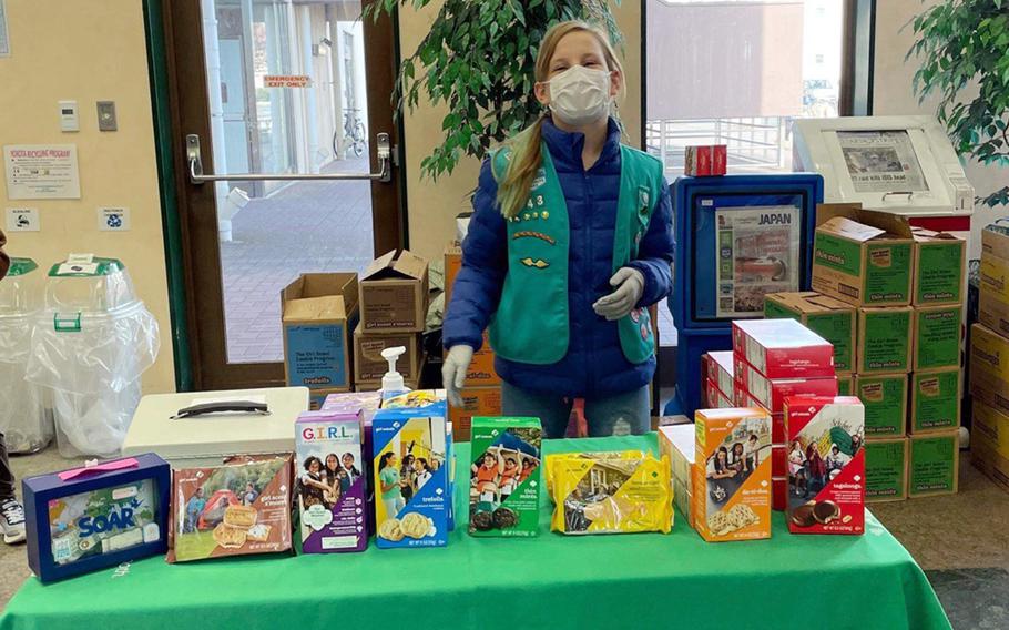 Girl Scout Maggie Kirkpatrick, 11, works the cookie booth at Yokota Air Base, Japan, Feb. 5, 2022. 