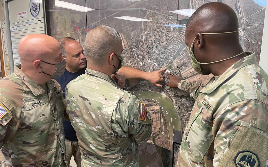 Members of the Louisiana National Guard coordinate Hurricane Ida response. 