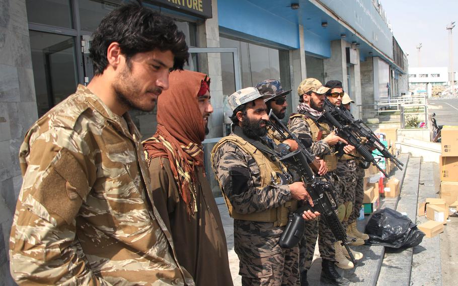 Taliban members are at the airport in Kabul, Afghanistan, Aug. 31, 2021. 