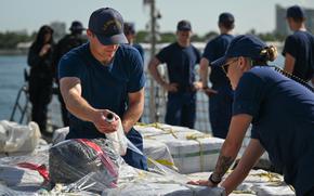 Crew members aboard U.S. Coast Guard Cutter Calhoun (WMSL 759) wraps a pallet of illegal narcotics in Port Everglades, May 16, 2025. Calhoun’s crew offloaded more than 19,055 pounds of cocaine and marijuana valued at approximately $140.9 million in Port Everglades, May 16, 2025. (Coast Guard photo by Petty Officer 3rd Class Jessica Walker)