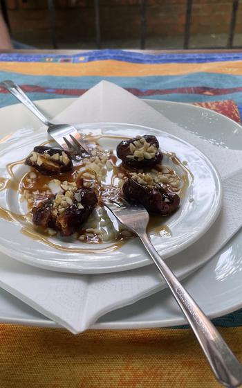 A dessert of dates covered with caramel sauce and chopped almonds at Mama of Africa in Wiesbaden, Germany. 