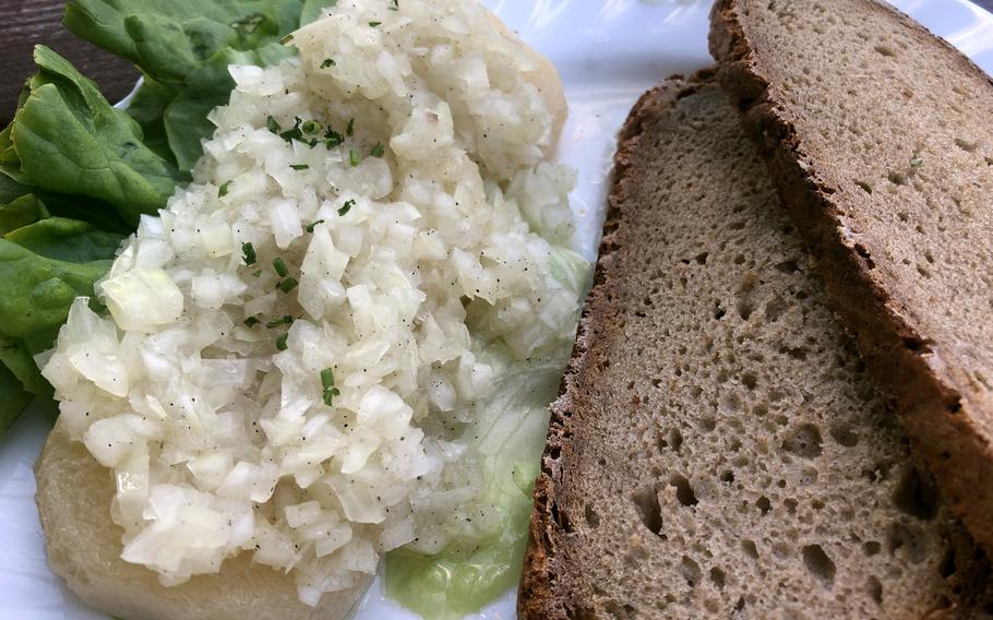 Handkaese with mussigg, as served at the Biergarten in Darmstadt, Germany. Handkaese is a relatively low-fat sour milk cheese that gets its name from how it was originally formed, with the hands. Mussigg, local slang for music, is a dressing served over the cheese. 