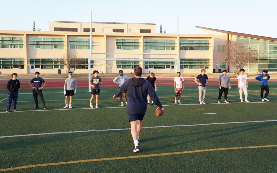 The Yokota High School Panthers learn football lessons from Ivy League players on their field at Yokota Air Base, Japan, Jan. 19, 2024.