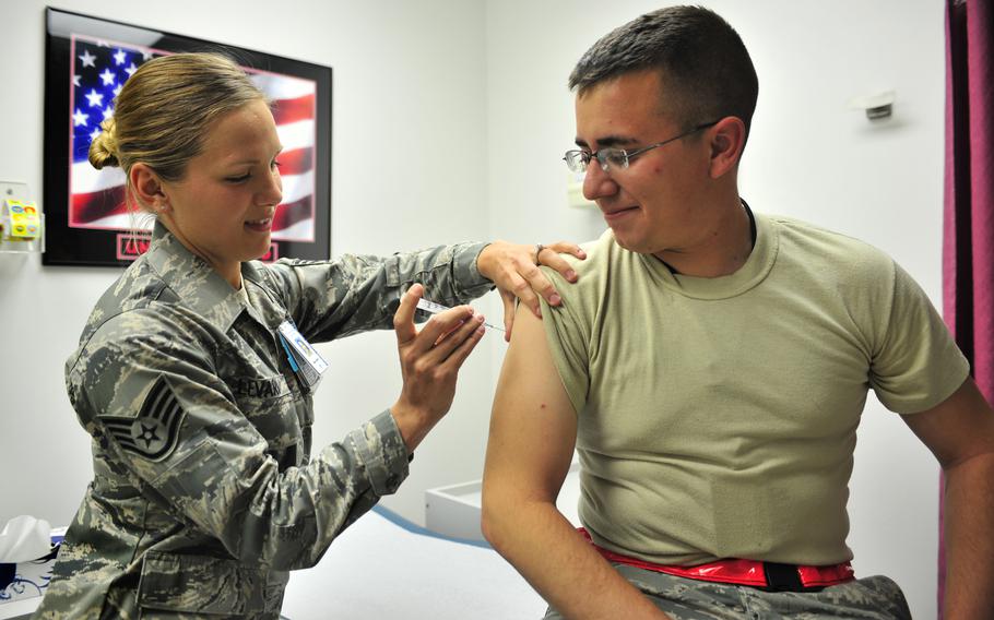 Staff Sgt. Dena Levari, 27th Special Operations Medical Operations Squadron NCOIC of immunizations, vaccinates 2nd Lt. Jose Valadez, 27th Special Operations Aircraft Maintenance Squadron, with Gardasil at Cannon Air Force Base, N.M., May 29, 2012. The vaccine protects against four types of HPV. Military doctors say a new vaccine mandate for active-duty troops would prevent most cervical cancer in women and stop the upward trend in male throat cancer.