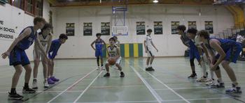 Alconbury captain Jonathan Reyna prepares for a free throw in the third quarter against Brussels on Friday, Jan. 20, 2023 at RAF Alconbury, England.