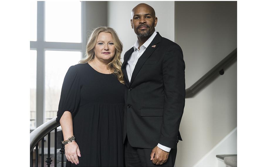 Lacey Adams and former surgeon general Jerome Adams stand inside their suburban Indianapolis home. As Lacey fights melanoma, the couple works to educate people on skin cancer, but they have had an unwelcome response.