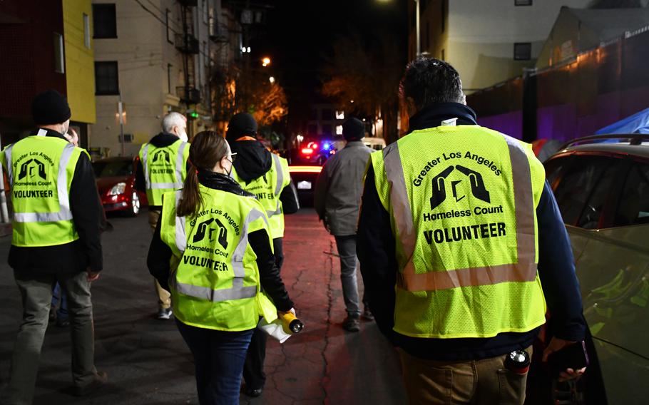 Rep. Mark Takano, D-Calif., right, walks the streets of Skid Row in downtown Los Angeles on Thursday, Feb. 24, 2022. Takano, the chairman of the House Committee on Veterans’ Affairs, joined Department of Veterans Affairs Secretary Denis McDonough and other volunteers to count homeless individuals in the area, part of the federal government’s annual “point-in-time” count.