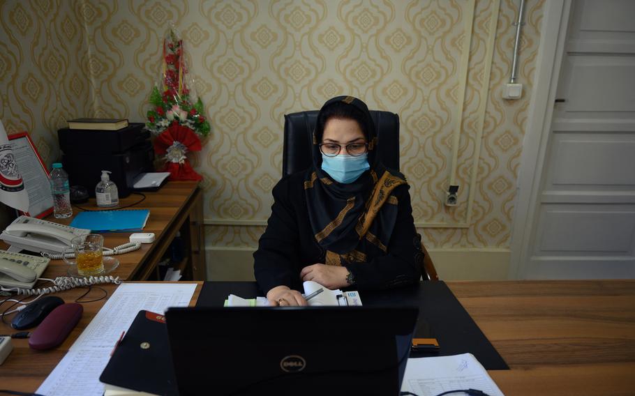 Dr. Seemin Mishkin Mohmand, director of the Rabia Balkhi public women's hospital, one of Kabul's busiest, sits in her office on October 23, 2022. At least 90 babies are born there in a 24-hour period but, despite the presence of 55 residents, an uptick in patients has spread the remaining doctors thin. MUST CREDIT: Photo for The Washington Post by Elise Blanchard.