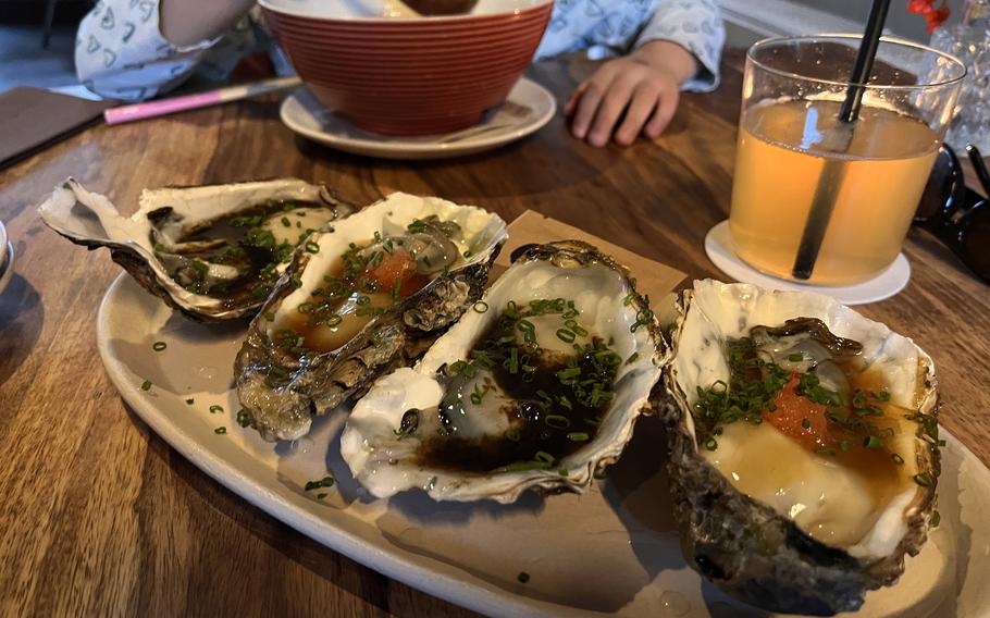 Oysters with ponzu and soy sauce-based flourishes at Muku in Frankfurt, Germany. 