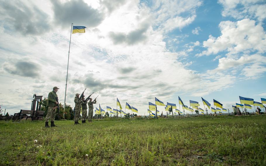 Ukrainian service members fire shots during a funeral for a fallen soldier in Dnipro, Ukraine, Sept. 20, 2022. 