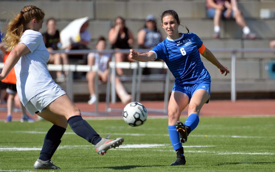 Ramstein’s Eleftheria Randitsas shoots as Lakenheath’s Sophia Yorko tries to block in a Division I girls semifinal at the DODEA-Europe soccer championships in Kaiserslautern, Germany, Wednesday, May 18, 2022. Ramstein won 1-0 to advance to Thursday’s final against Stuttgart.