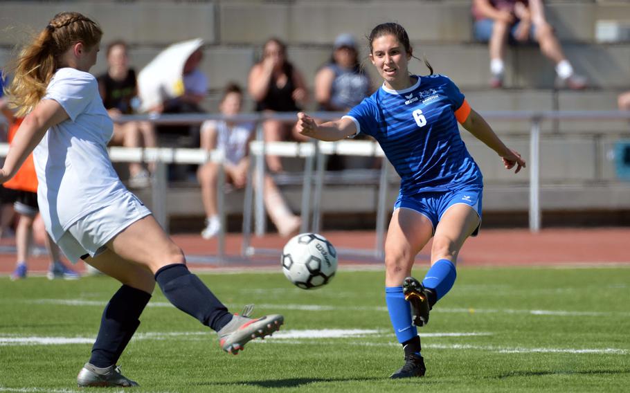 Ramstein’s Eleftheria Randitsas shoots as Lakenheath’s Sophia Yorko tries to block in a Division I girls semifinal at the DODEA-Europe soccer championships in Kaiserslautern, Germany, Wednesday, May 18, 2022. Ramstein won 1-0 to advance to Thursday’s final against Stuttgart.