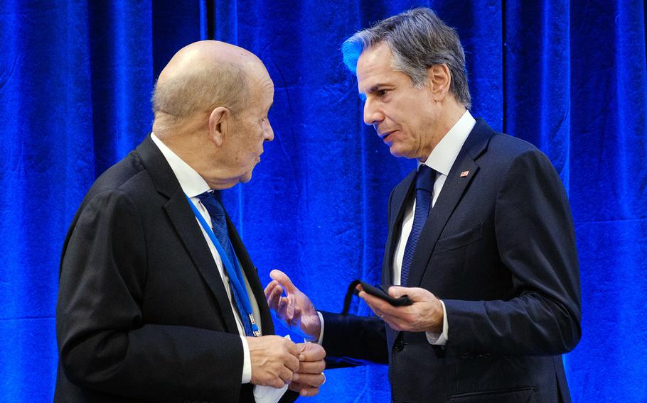 French Foreign Minister Jean-Yves Le Drian, left, talks with Secretary of State Antony Blinken during the NATO foreign ministers meeting in Riga, Latvia, Dec. 1, 2021.