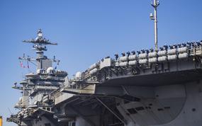 241220-N-VD554-1215 NAVAL AIR STATION NORTH ISLAND, Calif. (Dec. 20, 2024) – Sailors salute aboard Nimitz-class aircraft carrier USS Abraham Lincoln (CVN 72) as they arrive at Naval Air Station North Island, Calif., Dec. 20, 2024. Lincoln returned home from a 5-month deployment as part of Carrier Strike Group (CSG) 3 in the U.S. 5th Fleet and 7th Fleet area of operations. (U.S. Navy photo by Mass Communication Specialist 1st Class Aron Montano)