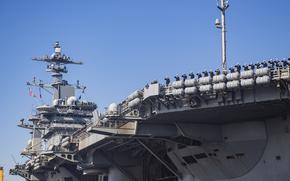 241220-N-VD554-1215 NAVAL AIR STATION NORTH ISLAND, Calif. (Dec. 20, 2024) – Sailors salute aboard Nimitz-class aircraft carrier USS Abraham Lincoln (CVN 72) as they arrive at Naval Air Station North Island, Calif., Dec. 20, 2024. Lincoln returned home from a 5-month deployment as part of Carrier Strike Group (CSG) 3 in the U.S. 5th Fleet and 7th Fleet area of operations. (U.S. Navy photo by Mass Communication Specialist 1st Class Aron Montano)