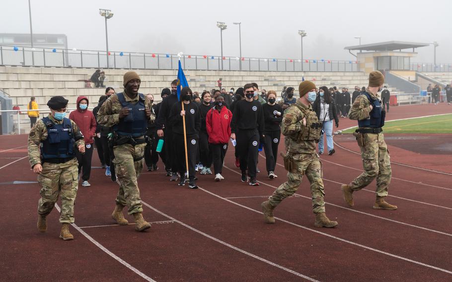 Military police at Kaiserslautern High School participate in a walk to mark Veterans Day on Thursday, Nov. 11, 2021.