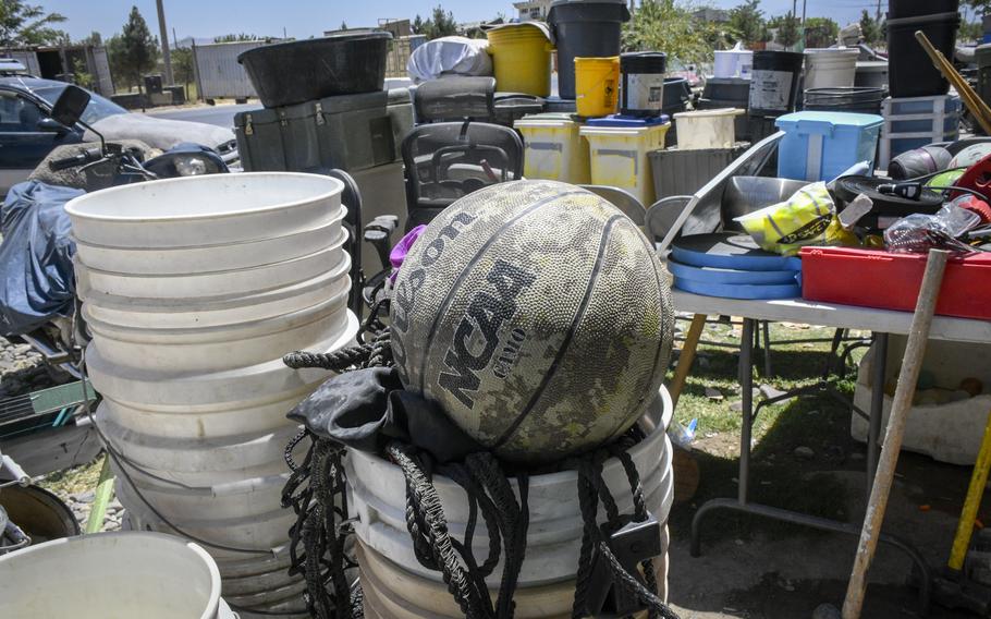 Items such as basketballs thrown out by U.S. and NATO troops departing Bagram Airfield, Afghanistan, are available for sale at shops outside the base June 5, 2021. 