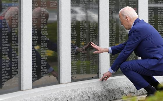 President Joe Biden visits the War Memorial in Scranton, Pa., Wednesday, April 17, 2024, and touches the wall near his uncle's name, Ambrose J Finnegan Jr., who died in WWII. (AP Photo/Alex Brandon)