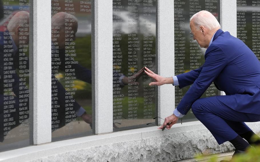 President Joe Biden visits the War Memorial in Scranton, Pa., Wednesday, April 17, 2024, and touches the wall near his uncle’s name, Ambrose J Finnegan Jr., who died in WWII.