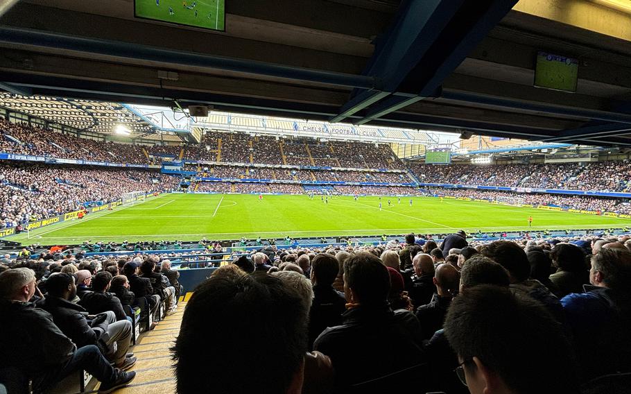 Supporters of Chelsea Football Club take in the action as the hometown team battles Leicester City in the FA Cup quarterfinal at Stamford Bridge, London, on March 17, 2024. 