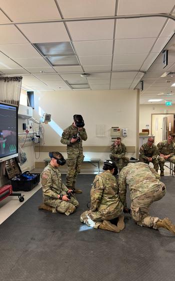 Members of the Army’s 173rd Airborne Brigade and the Air Force’s 31st Medical Group train with a virtual reality system at Aviano Air Base in Italy. The VR simulations allow service members to switch from a battlefield scene to a hospital emergency room at the touch of a button.
