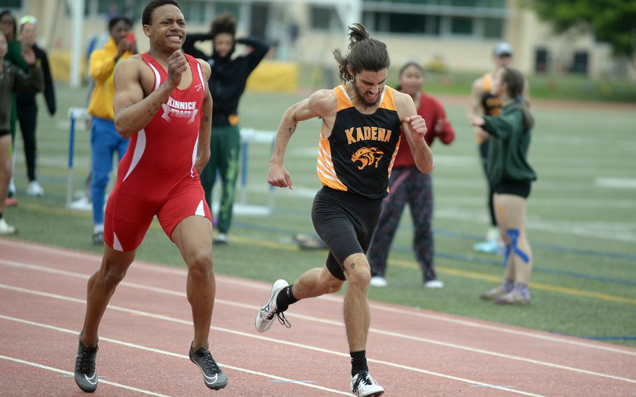 Nile C. Kinnick's Jeremiah Hines and Kadena's Christian Espitia hit the wire together in the 400, Hines in 50.15 and Espitia in 50.16 in a photo finish.