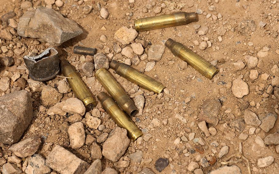 Used gun shell casings lie in the gravel at a public range in Sierra Blanca, Texas, March 22, 2023.