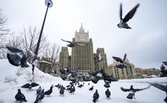Pigeons take off in front of the Russian Foreign Ministry building in Moscow, Russia, Wednesday, Jan. 26, 2022. Russian Foreign Minister Sergey Lavrov said he and other top officials will advise President Vladimir Putin on the next steps after receiving written replies from the United States to the demands. Those answers are expected this week — even though the U.S. and its allies have already made clear they will reject the top Russian demands. (AP Photo/Alexander Zemlianichenko)