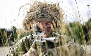 A cadet from Britain's Royal Military Academy Sandhurst helps form a security perimeter ahead of a live-fire drill at Grafenwoehr Training Area, Germany, on July 9, 2025, during exercise Dynamic Victory.