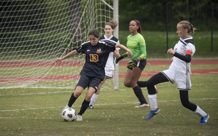 Dalilah Lambarena tries to get the ball away from the goal.