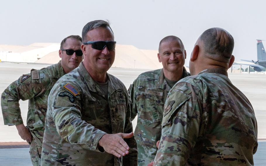 Army Gen. Michael Erik Kurilla greets airmen at an undisclosed location.