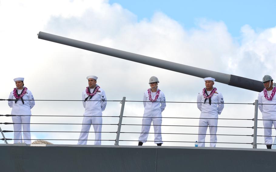 Sailors man the rails of the future USS Daniel Inouye as it arrives at Joint Base Pearl Harbor-Hickam, Hawaii, Thursday, Nov. 18, 2021.
