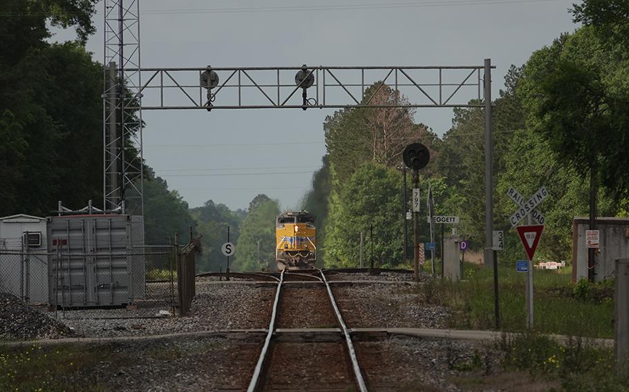 A Union Pacific Railroad freight train recedes into the distance, heading south out of Leggett, Tex., on April 19, 2023. 
