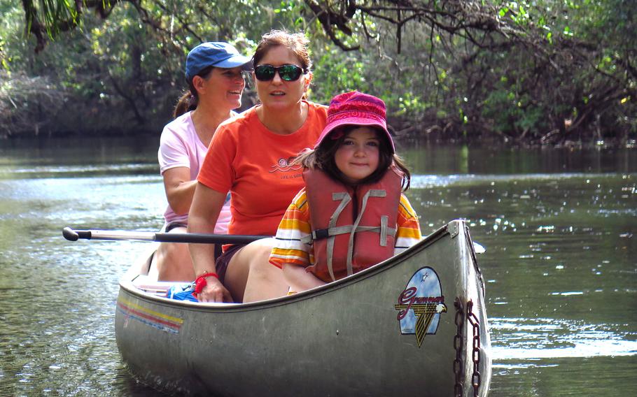 The author’s daughter, Christina, and his sisters, Rachel Briley, left, and Gina Space, float through Hillsborough River State Park outside Tampa in 2017. 