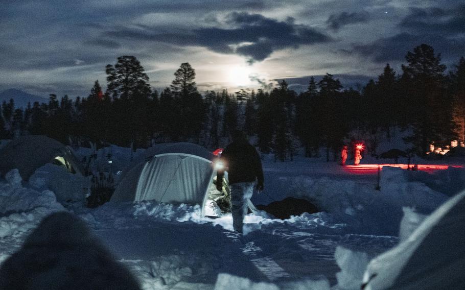 A Marine with 3rd Battalion, 6th Marine Regiment, 2nd Marine Division, II Marine Expeditionary Force walks toward a tent prior to Exercise Cold Response in Setermoen, Norway, on  Feb. 17, 2022.