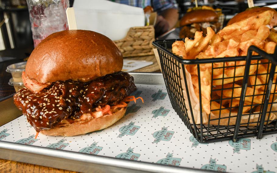 The Korean barbecue sandwich at Benji’s Birdhouse comes with the restaurant’s own kimchi. The restaurant serves American-style chicken for clientele in Germany.
