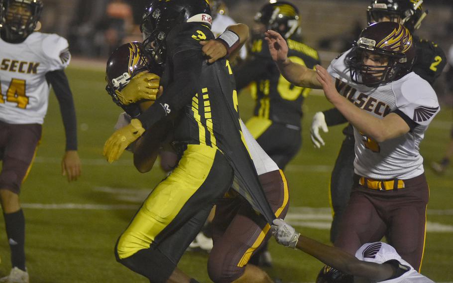 It took three Vilseck defenders to bring down Stuttgart's Vincent Allen on this play in the DODEA-Europe Division I title game at Kaiserslautern, Germany on Oct. 30, 2021.