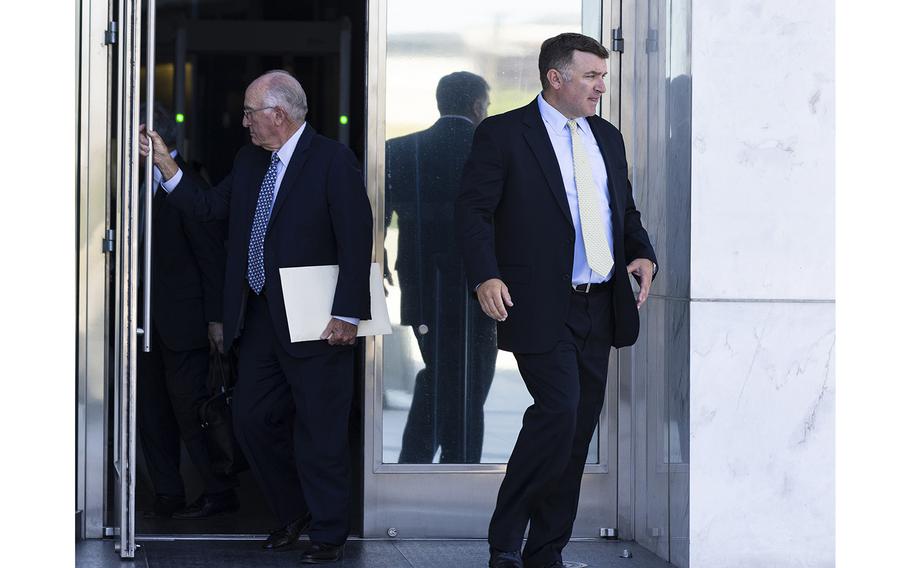 FBI agent Scott Carpenter, right, leaves the Lloyd D. George Federal Courthouse after his sentencing on Aug. 17, 2022, in Las Vegas. Carpenter was accused of gambling away $13,000 in government money. 