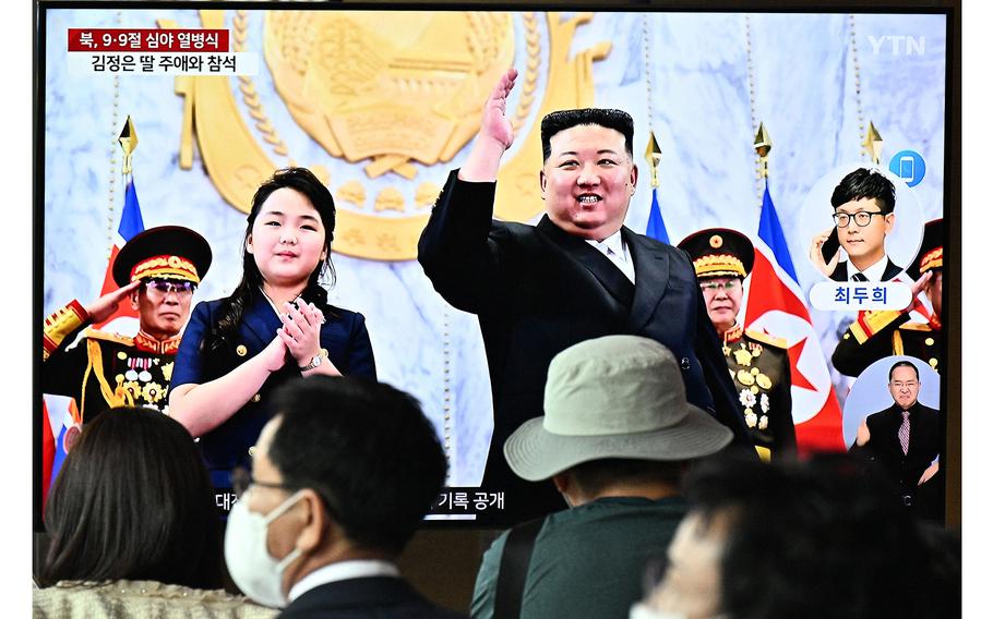 People sit in front of a television showing a news broadcast with a photo of North Korea’s leader Kim Jong Un and his daughter attending a parade marking the 75th anniversary of the country’s founding, at a railway station in Seoul on Sept. 9, 2023.