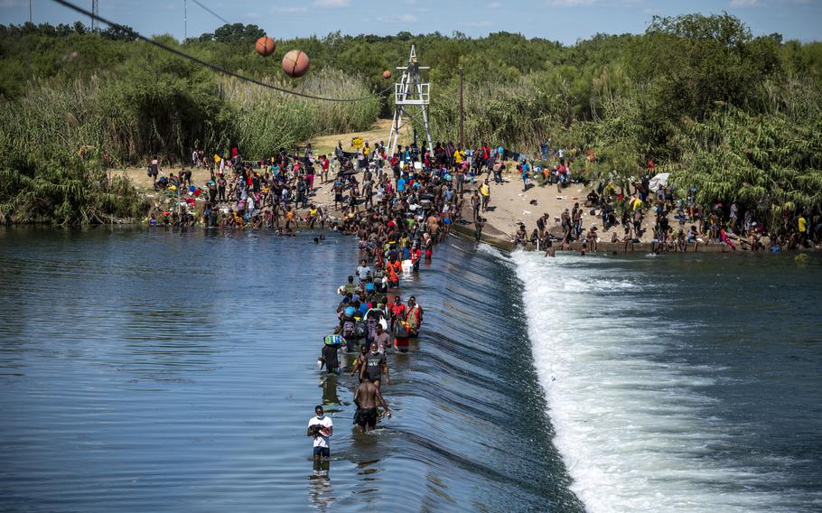 Migrants cross back and forth between the United States and Mexico at the Rio Grande in Ciudad Acuna, Mexico.