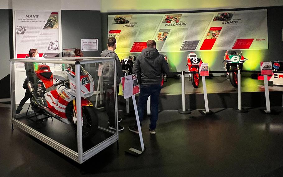 Visitors get a close view of Moto-GP motorcycles past and present at Ringwerk in Nuerburg, Germany, Jan. 15, 2022. 